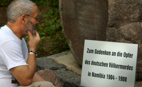 Israel Kauntajike at a memorial grave in Berlin. Photo: DPA