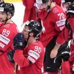 Austria helps Switzerland to hockey quarterfinals