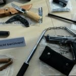 Huge weapons cache found at home of hate speech suspect