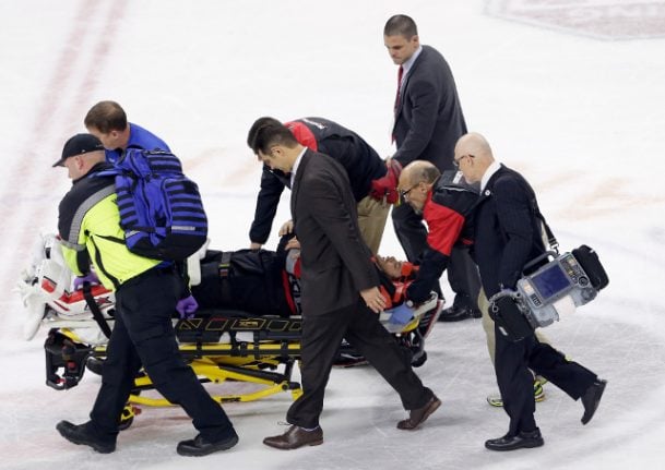 Scary pictures of Eddie Läck stretchered off ice after violent collision
