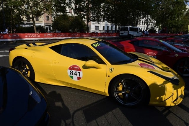 A yellow Italian Ferrari  on display at the Corso Sempione in Milan. Photo: MIGUEL MEDINA / AFP