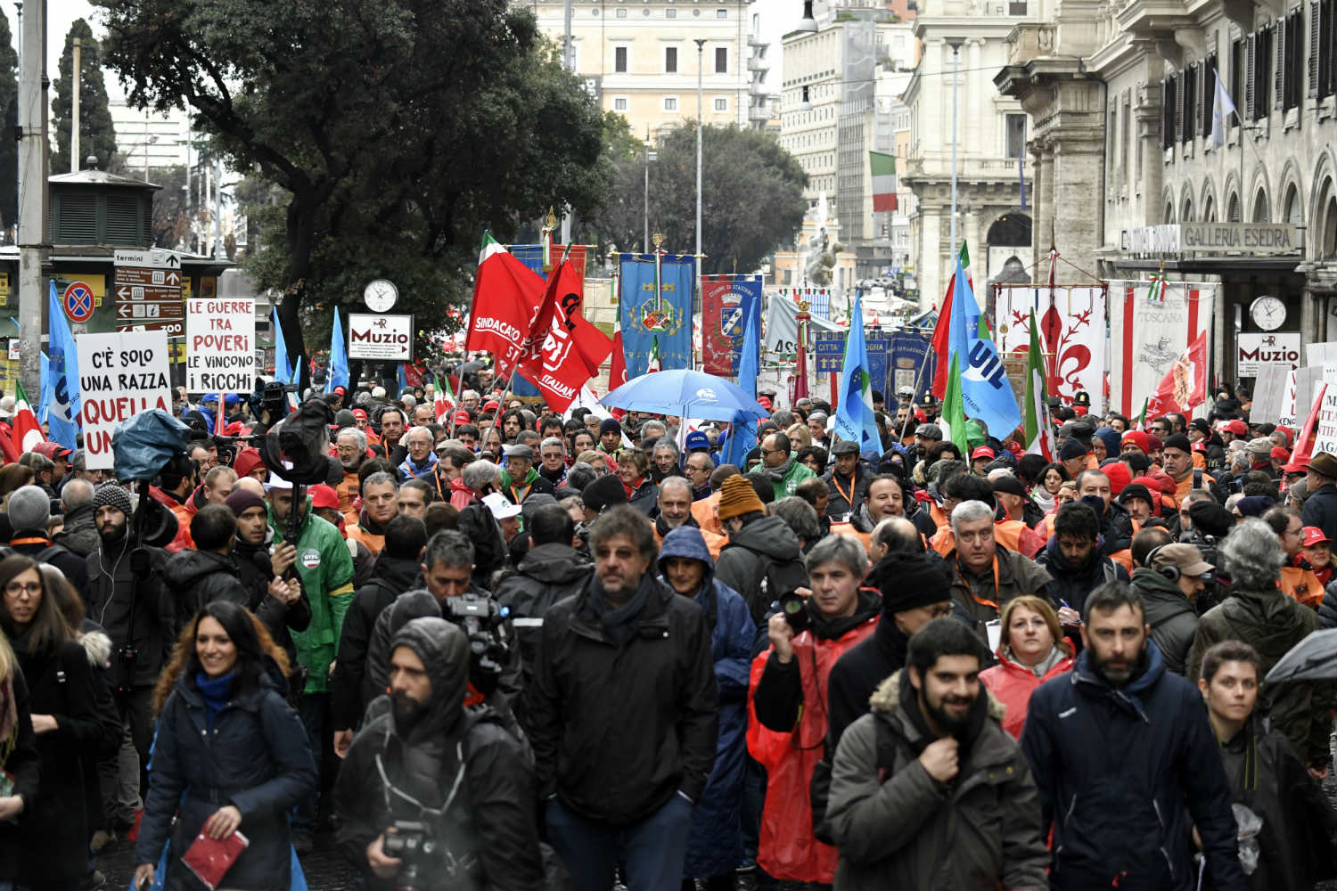 Tens of thousands march in rival protests across Italy