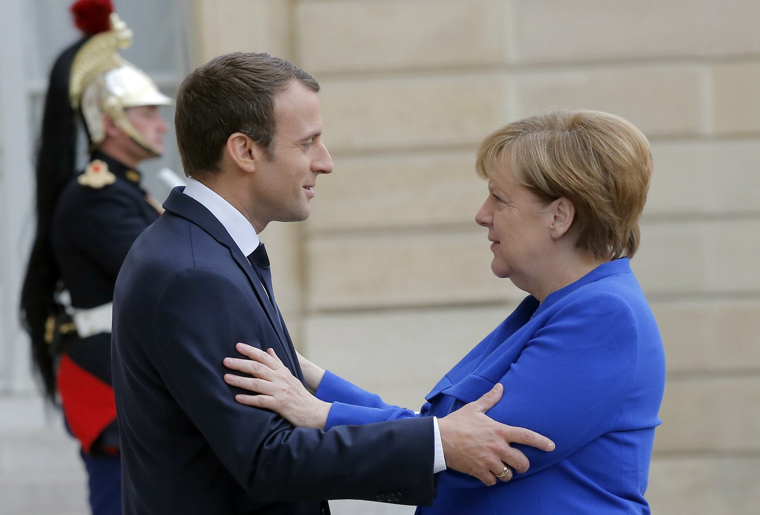 Merkel and Macron put defence at heart of blooming ties