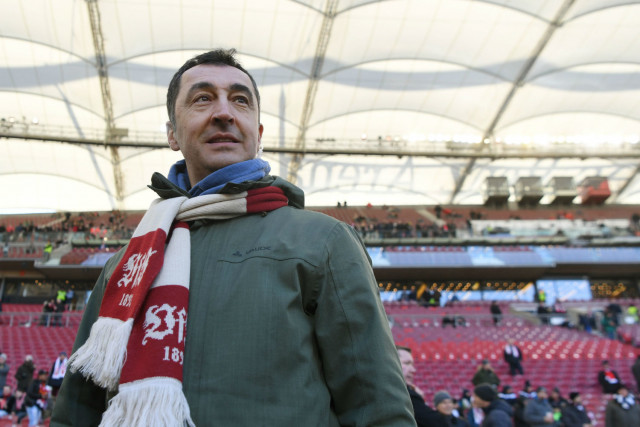 The Green Party's Cem Özdemir, pictured here attending a match his hometown football club VfB Stuttgart, has criticised Özil.