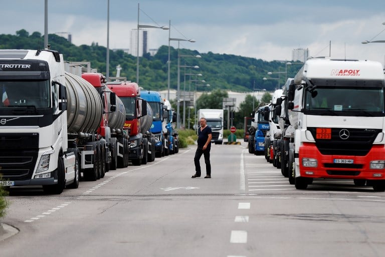 Striking French truckers and farmers set to add to Macron's woes