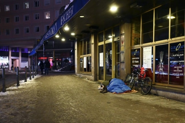 A homeless man sleeps on the streets in Strasbourg, eastern France. 