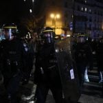Macron rushed from Paris theatre after protesters break in