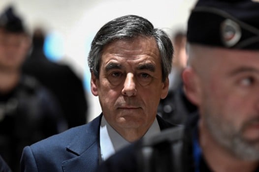 Macron seeks review of fraud case against ex-rival Fillon