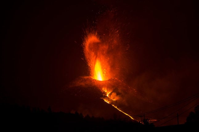 The Cumbre Vieja volcano, pictured from El Paso, spews lava, ash and smoke, in the Canary Island of La Palma.