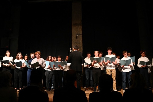 Choir of students sing at a tribute to murdered schoolteacher Samuel Paty at Jean-de-la-Fontaine high school in Paris