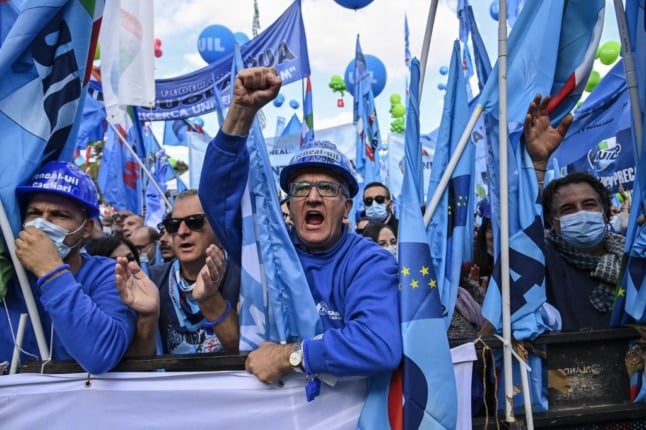 Workers from the Italian Labour Union (UIL) react during an anti-fascist rally in Rome