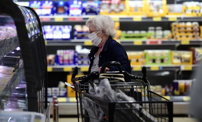 Woman in mask in supermarket