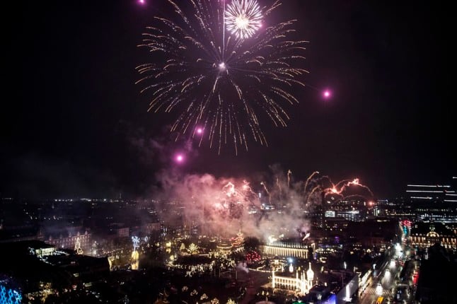 Fireworks are set off over Copenhagen on December 31st 2020.