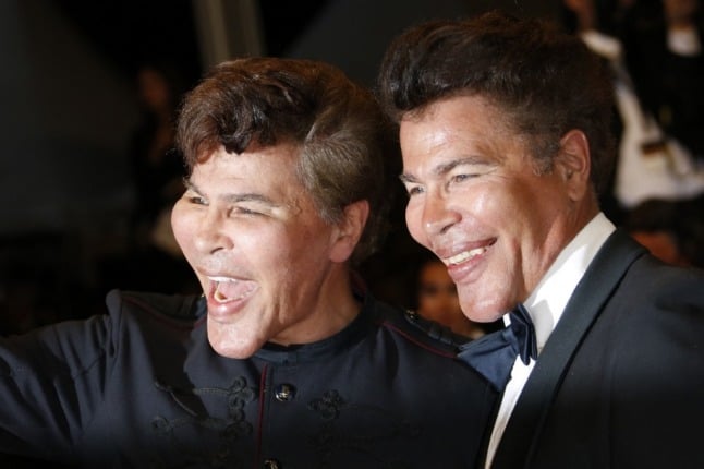 Grichka and Igor Bogdanoff pose during the Cannes Film Festival.